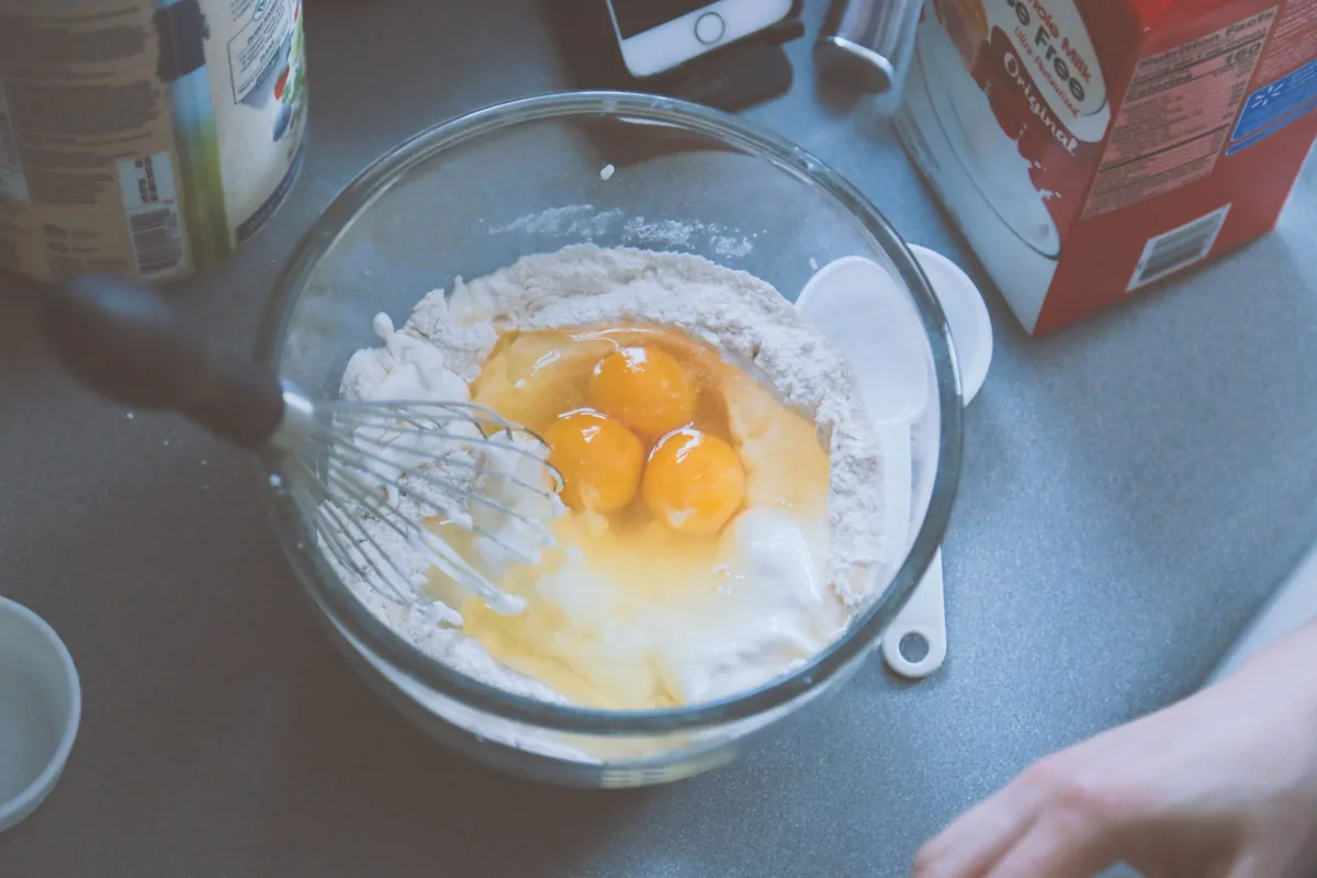 Whisking eggs in a glass bowl