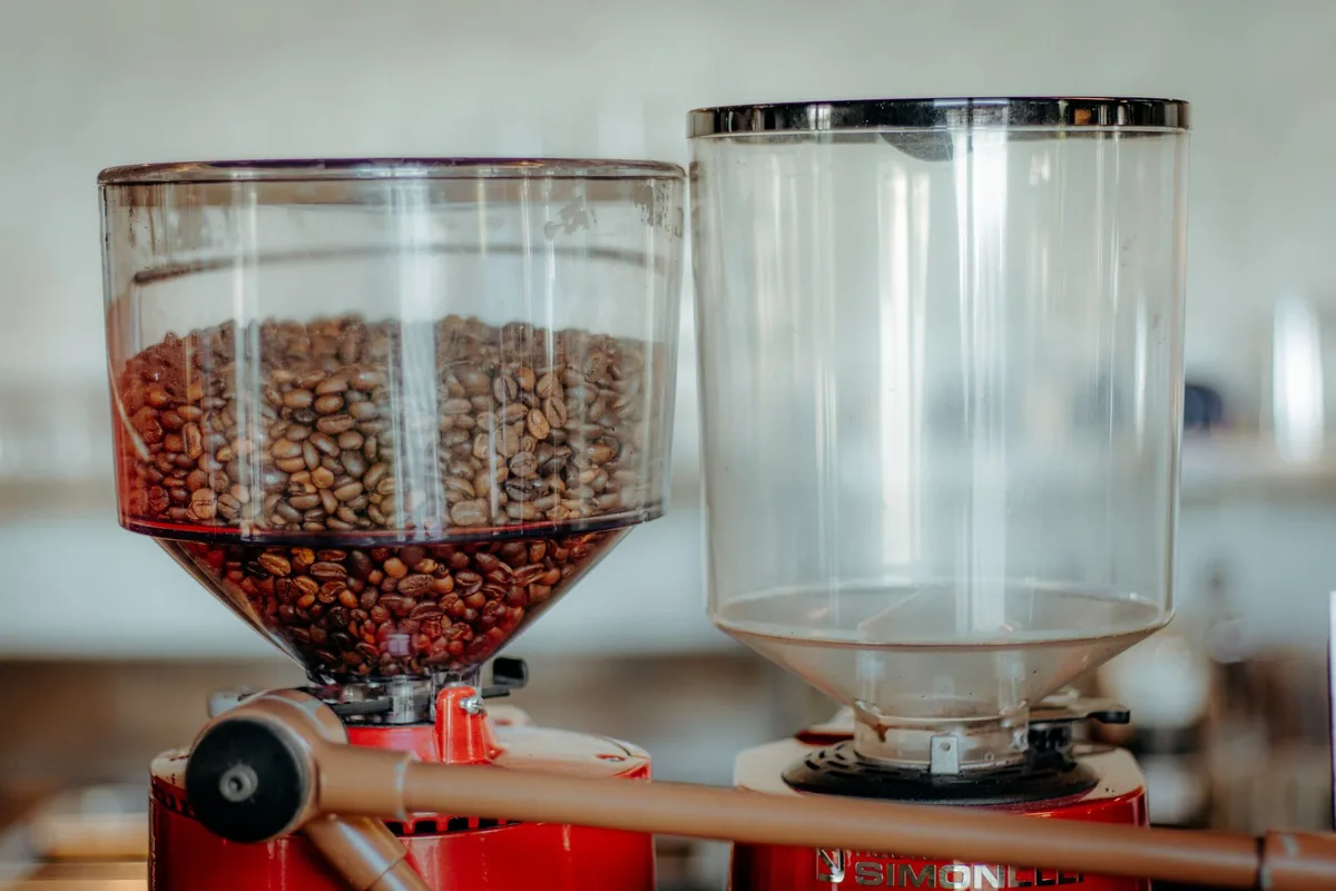 Whole coffee beans in a hopper