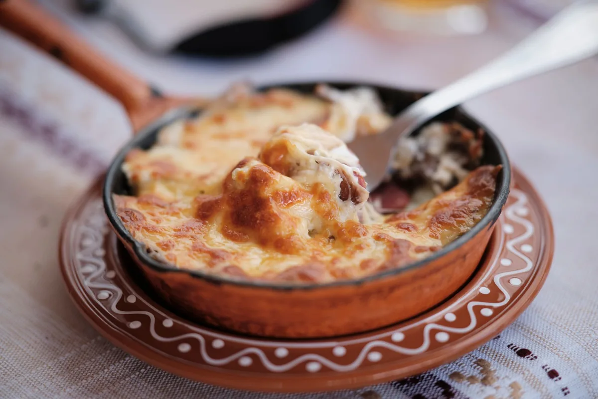 A baked gratin in an oval terracotta dish