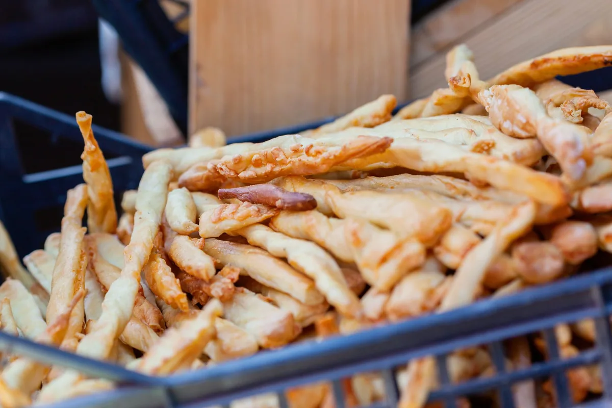 A basket of baked breadsticks