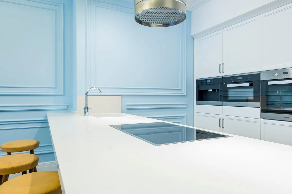 A bright, uncluttered kitchen worktop beside a window