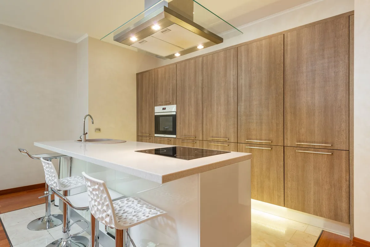 A flat black induction cooktop set into a light kitchen worktop