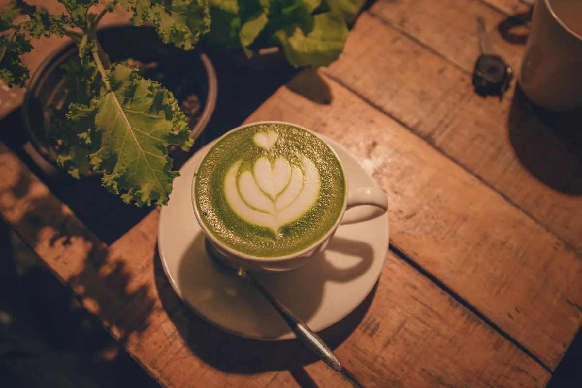 A matcha latte on a wooden table