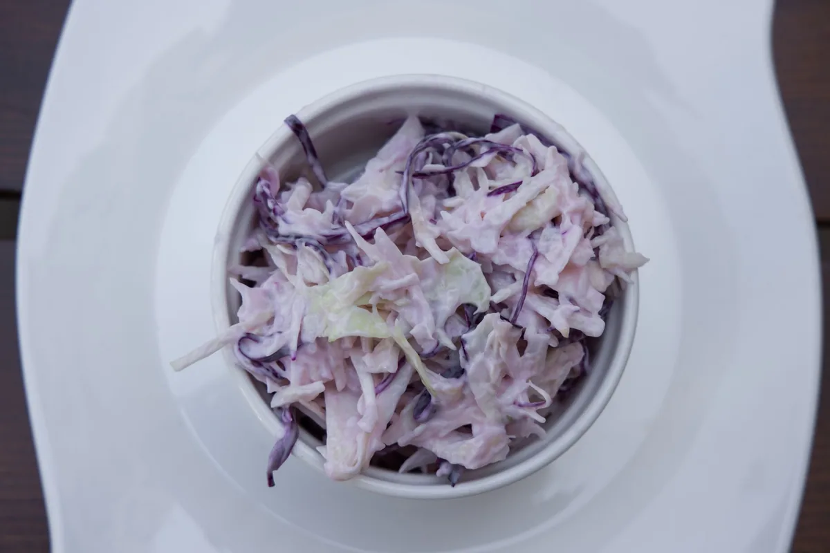 A bowl of shredded purple cabbage slaw