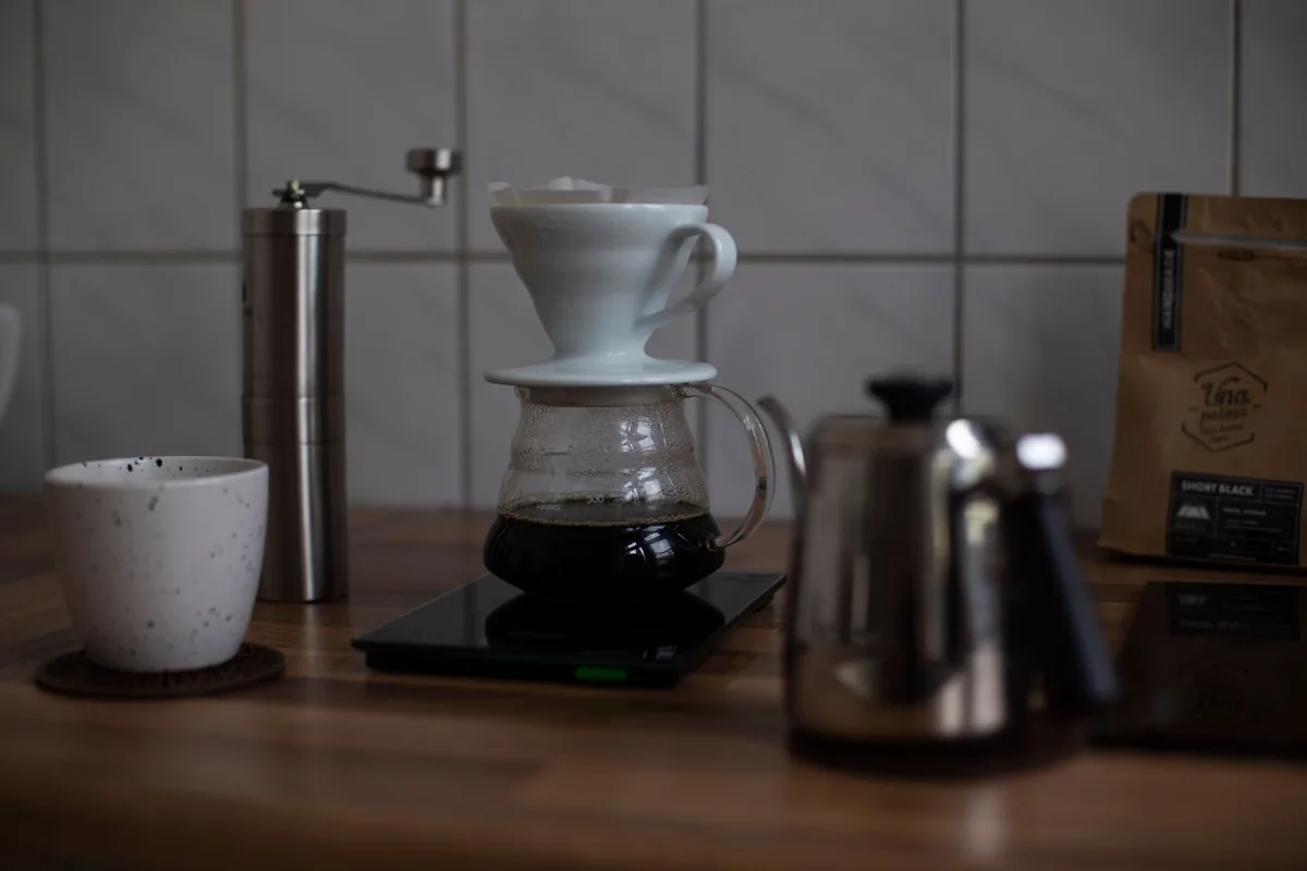 A pour-over coffee setup on a digital kitchen scale