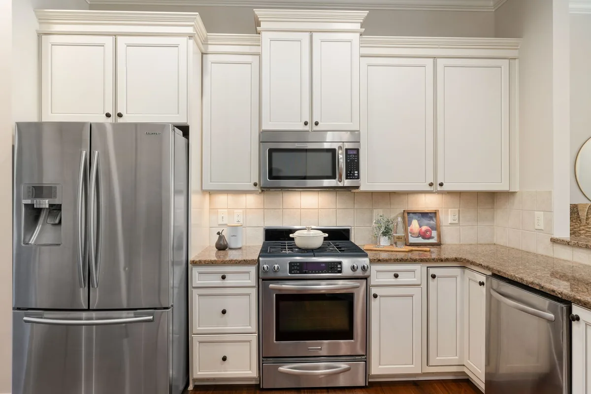 A stainless steel appliance on a clean, bright kitchen countertop