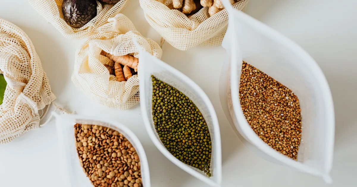Bowls of grains and nuts on a white table