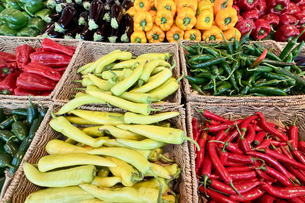 Bright peppers stacked in crates at a market