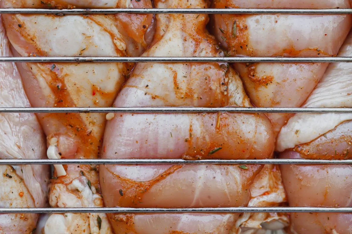 Chicken pieces coated in a red marinade