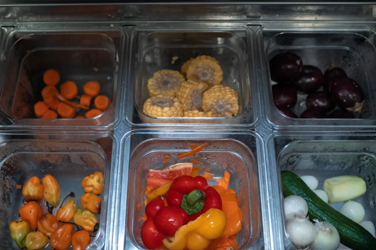 Clear containers of chopped vegetables
