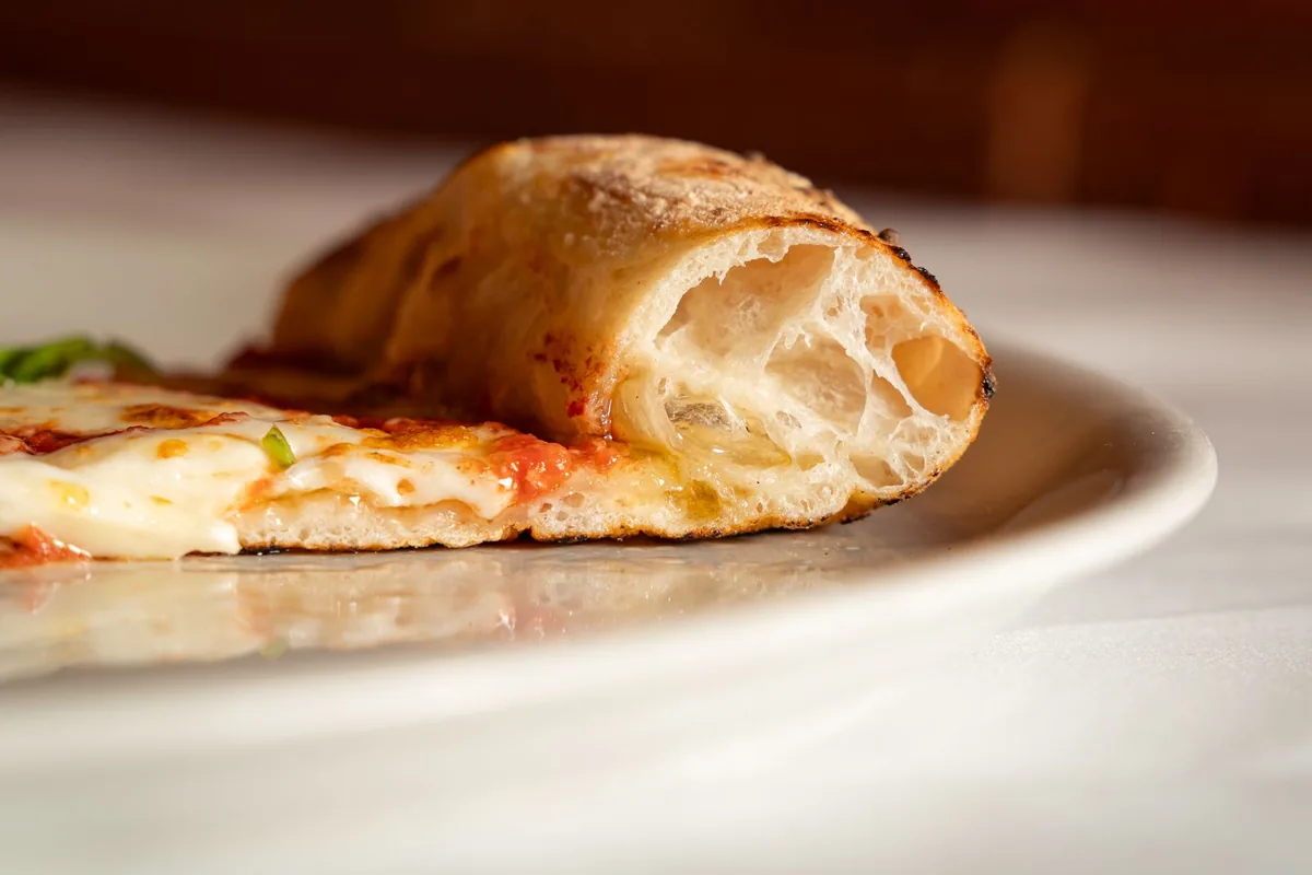 Close-up of a baked pizza crust edge