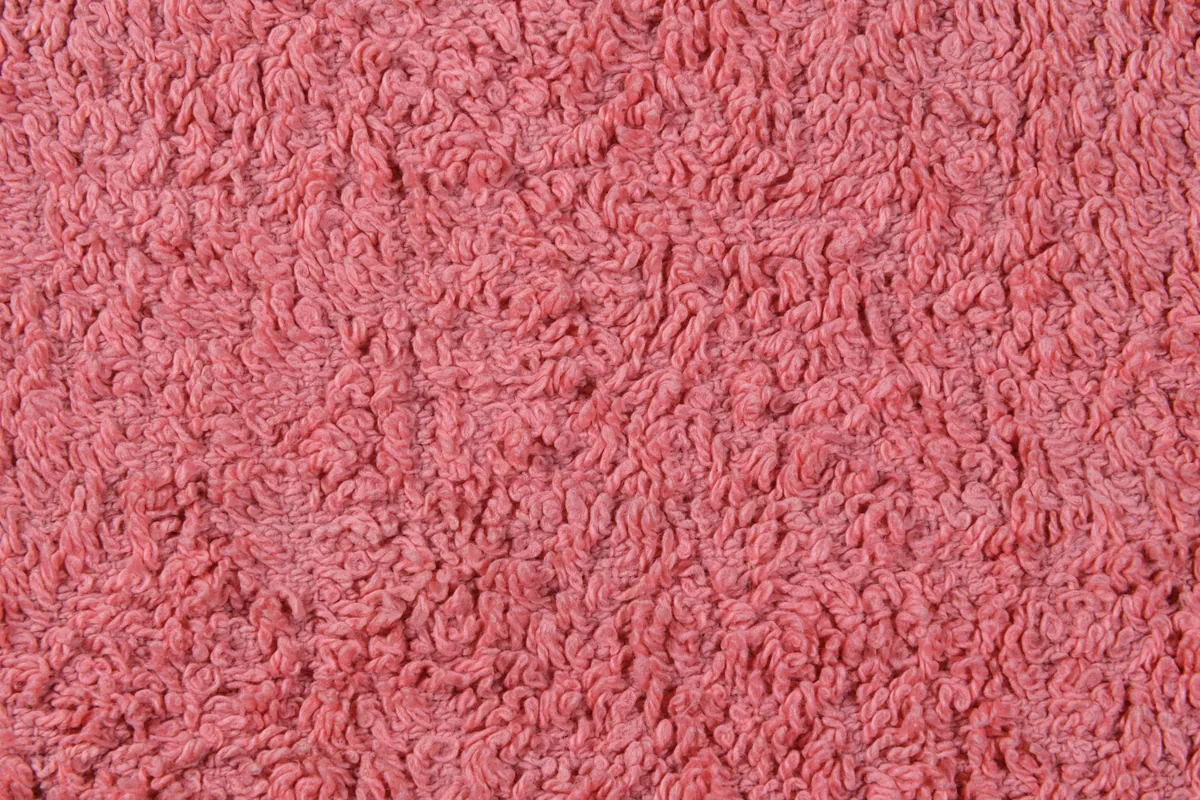 Close view of looped terry cotton fabric in a soft neutral colour