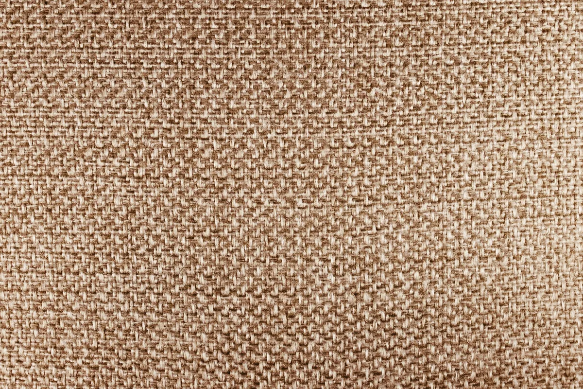 Close view of the woven texture of a heavy natural cotton canvas fabric