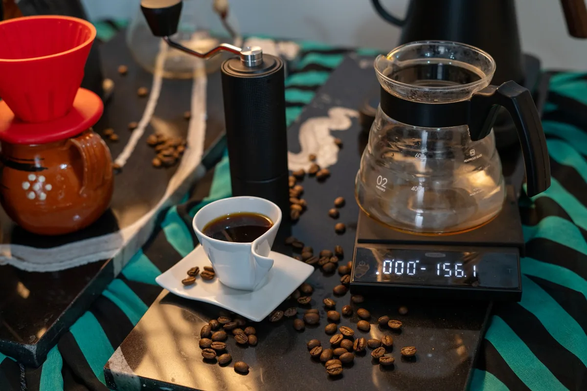 Coffee beans being weighed on a digital scale