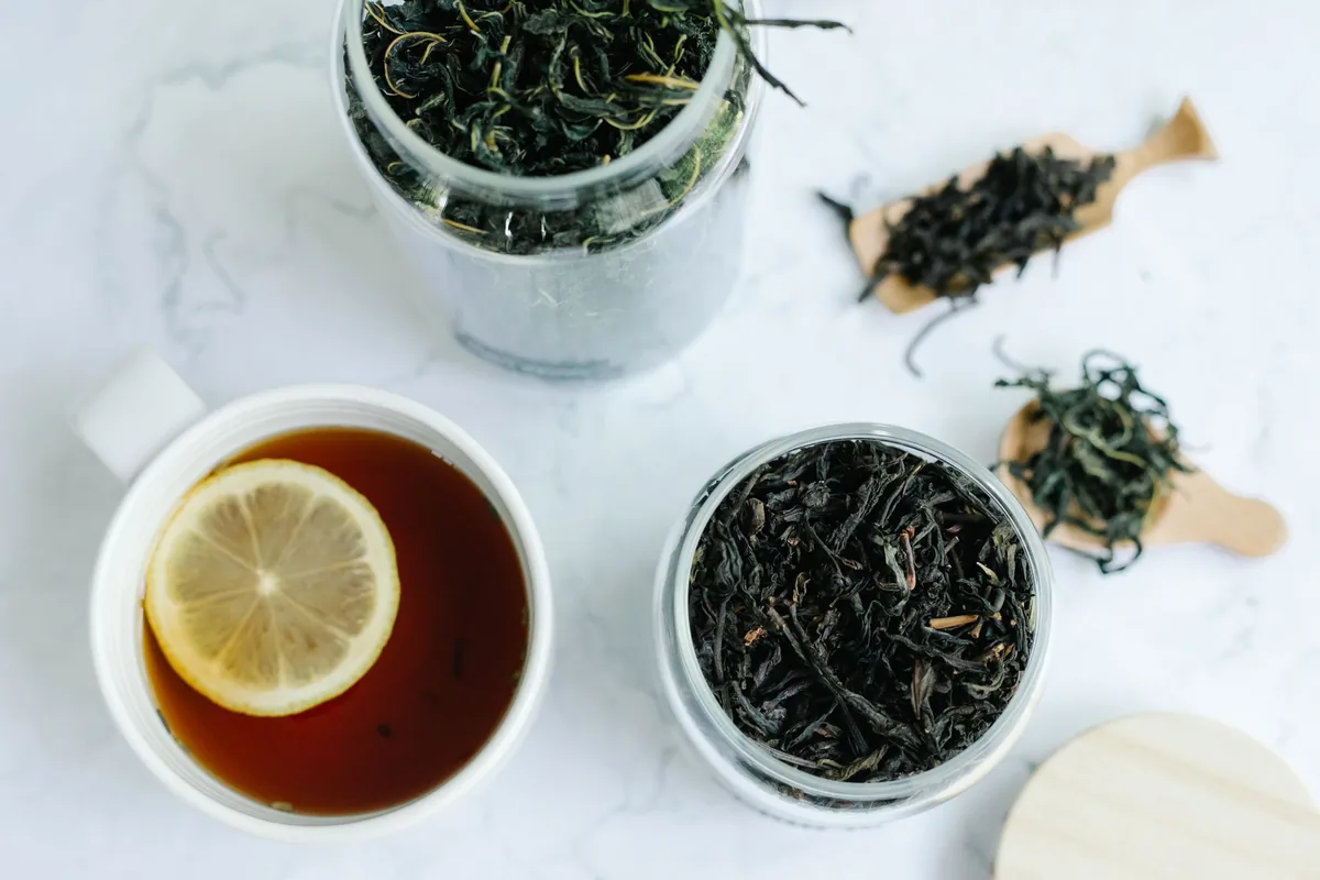 Loose-leaf tea steeping in a glass cup