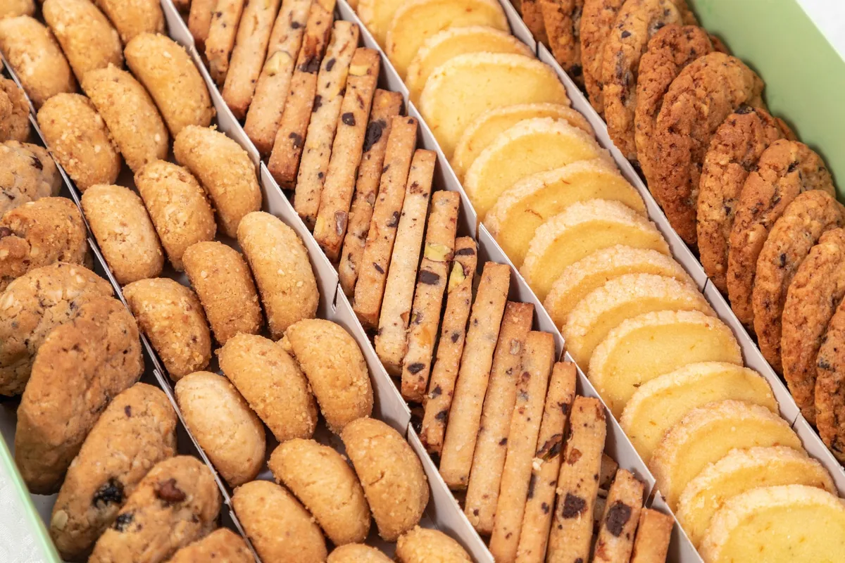 Rows of assorted baked cookies on a tray