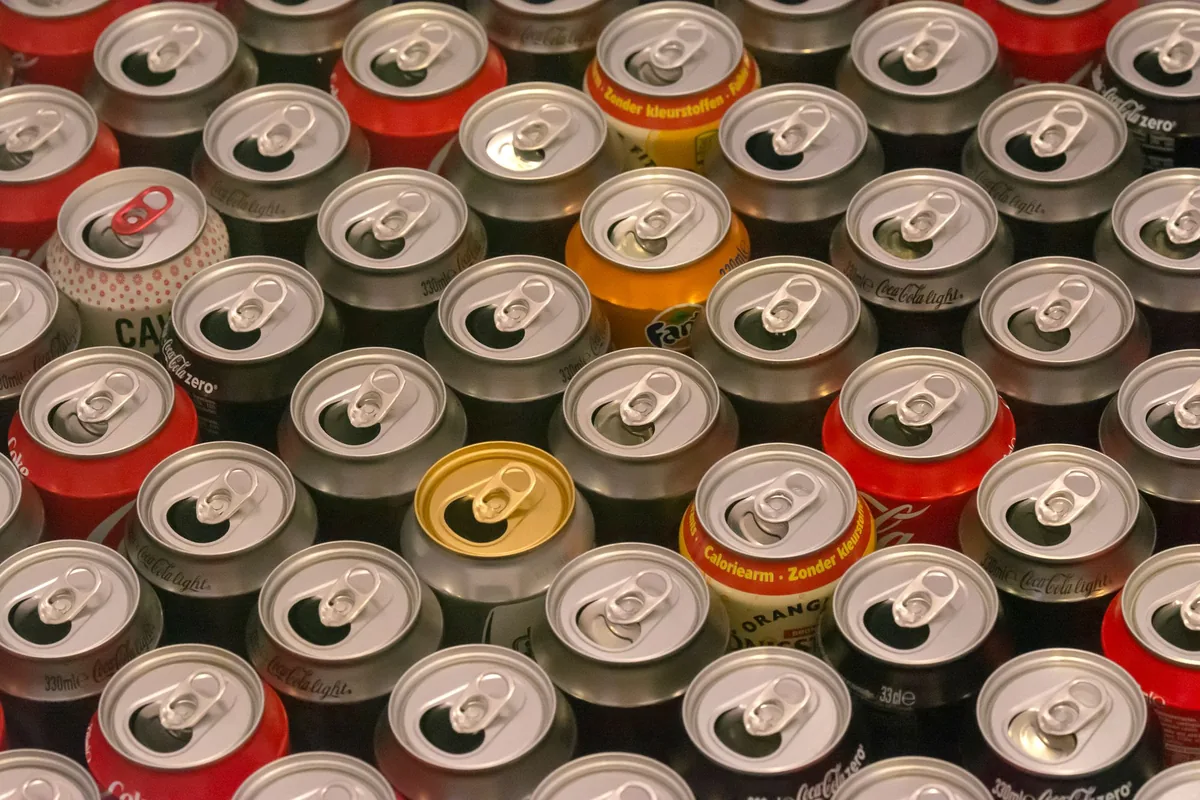Rows of drink cans seen from above