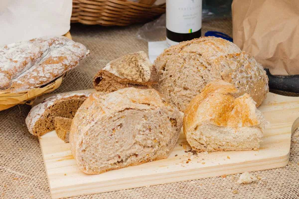 Rustic loaves of bread on a wooden board