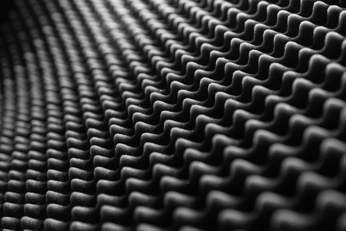 Close-up of a dark ridged foam surface