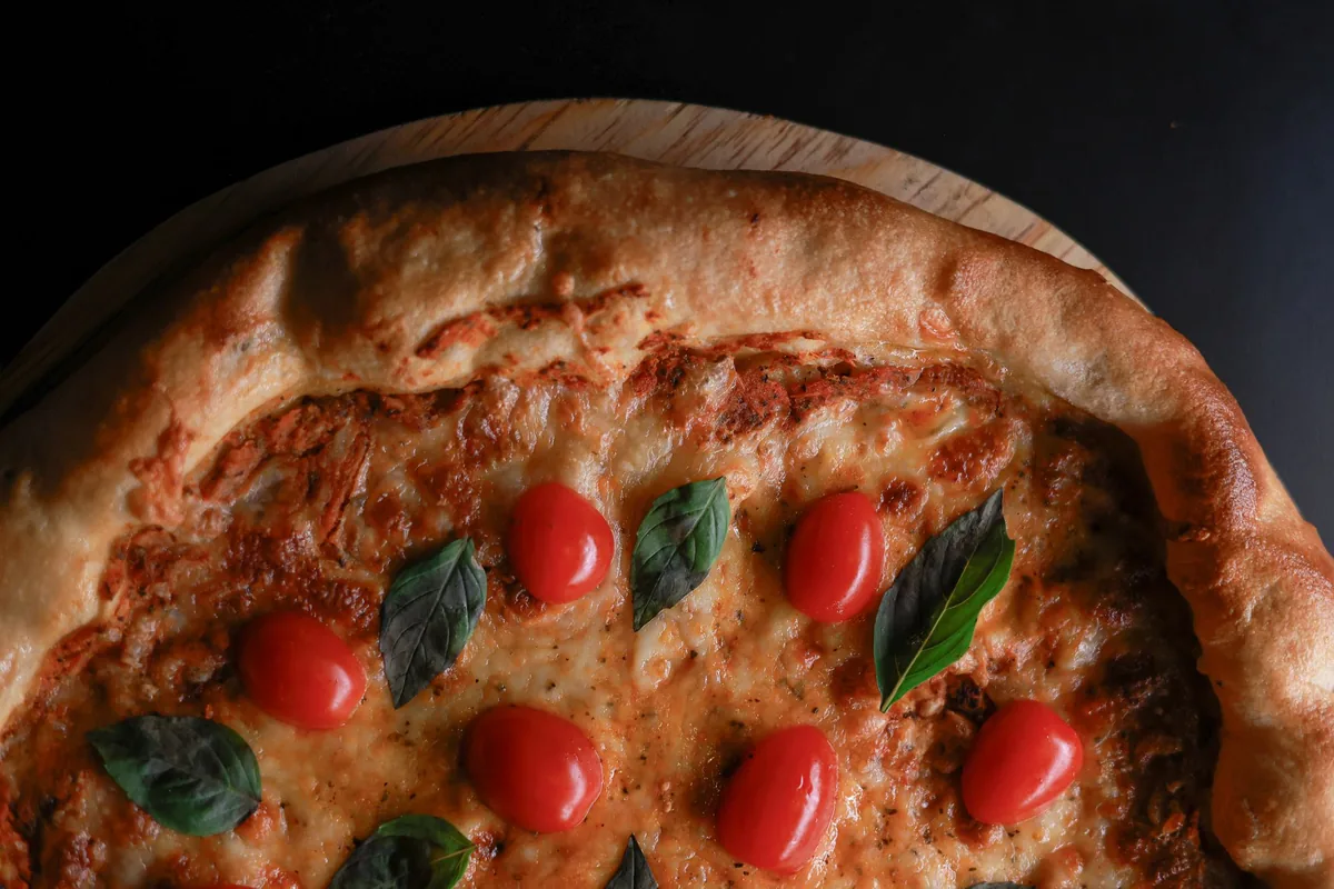 Square deep dish pizza with crispy cheese edges