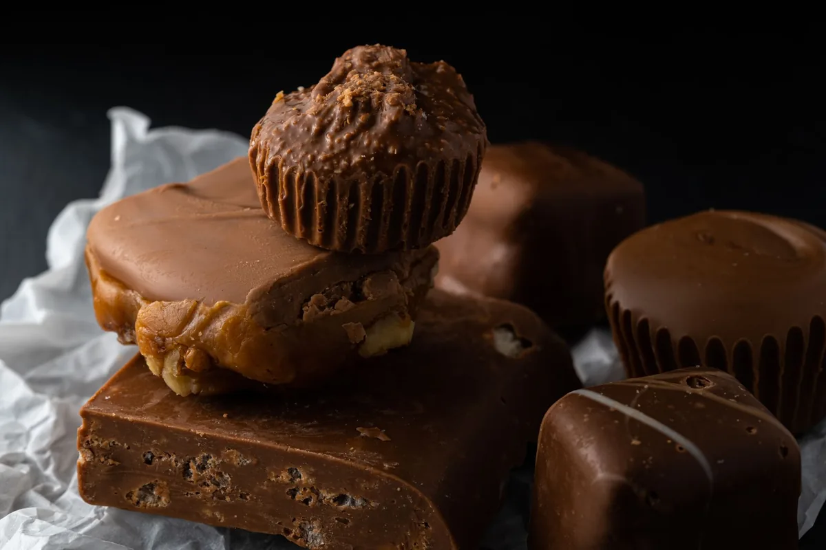 Chocolate fudge squares and a muffin on parchment