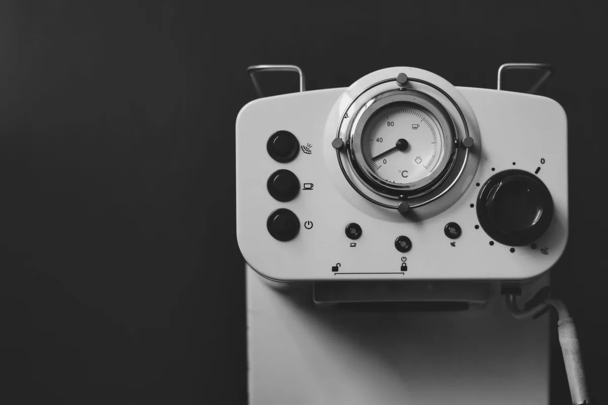 The pressure gauge on the front of an espresso machine