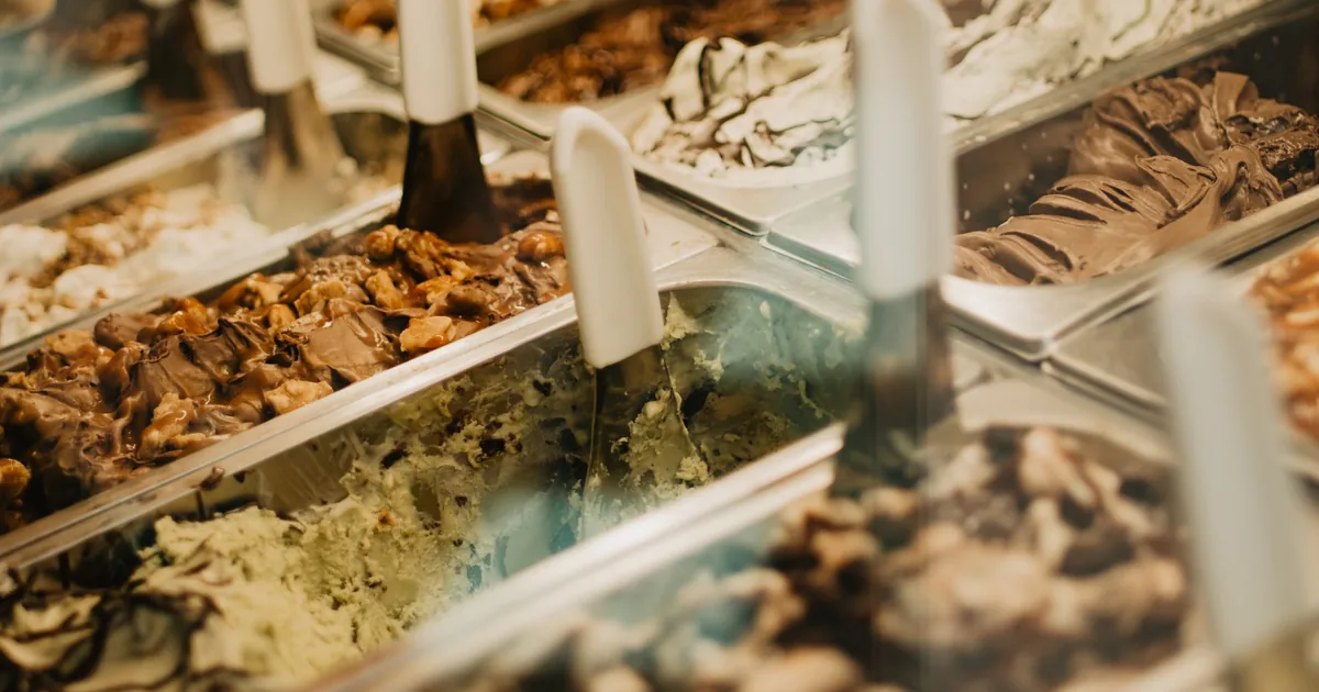Tubs of ice cream in a freezer display